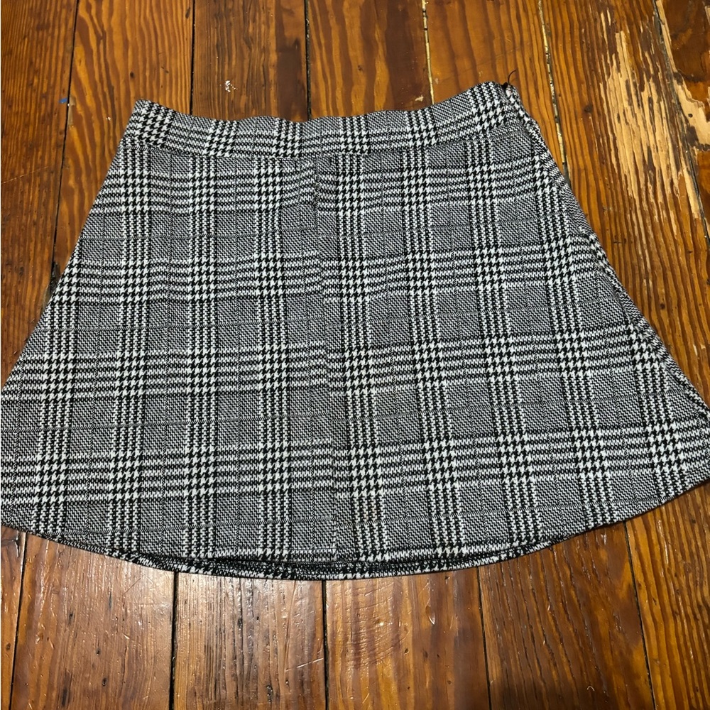 Brandy Melville plaid skirt. One size. I think would fit size XS/S.